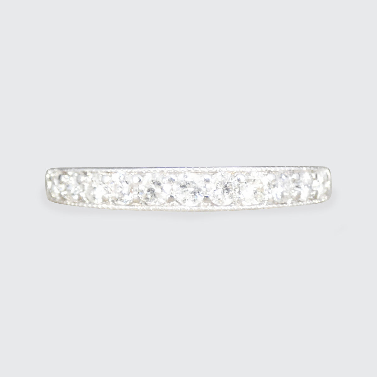 Diamond ring on a light gray background