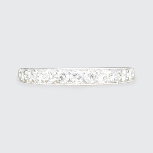 Diamond ring on a light gray background