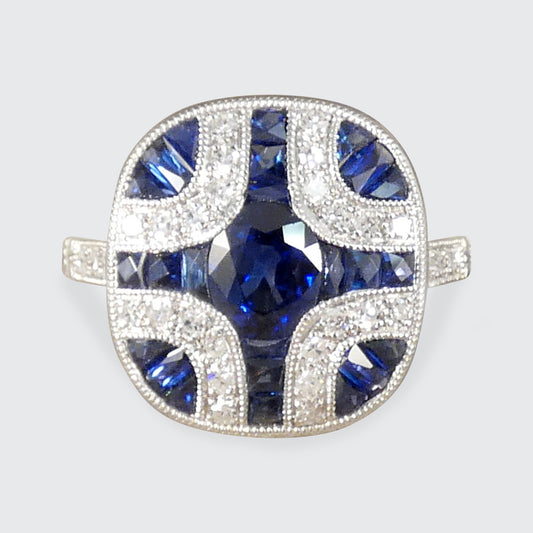 A gorgeous Art Deco style Sapphire and Diamond geometric cross style ring in Platinum.