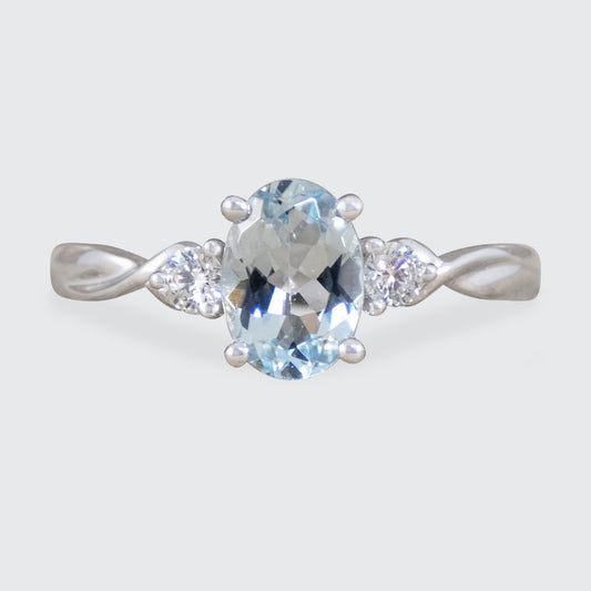 Modern Oval Cut Aquamarine and Brilliant Cut Diamond Three Stone in Platinum.