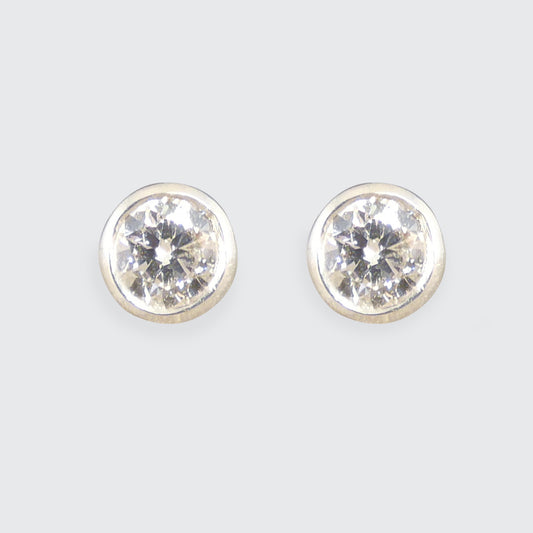 A classic pair of Bezel set Diamond Stud Earrings in Platinum holding 0.80ct with a GIA cert and bright E Colour grading.