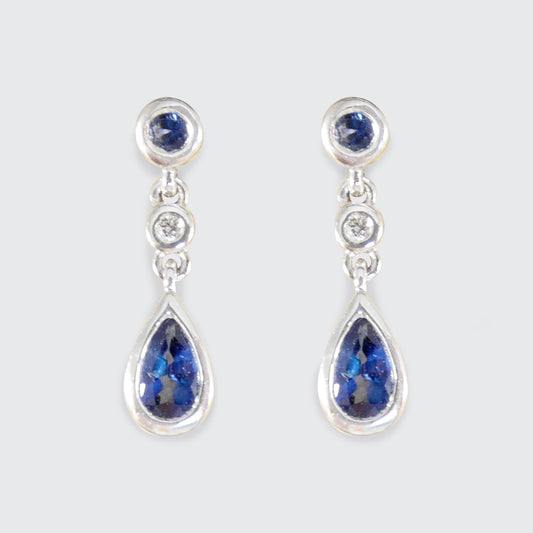 A pair of White Gold earrings are Ceylon Sapphire gemstones and diamonds.