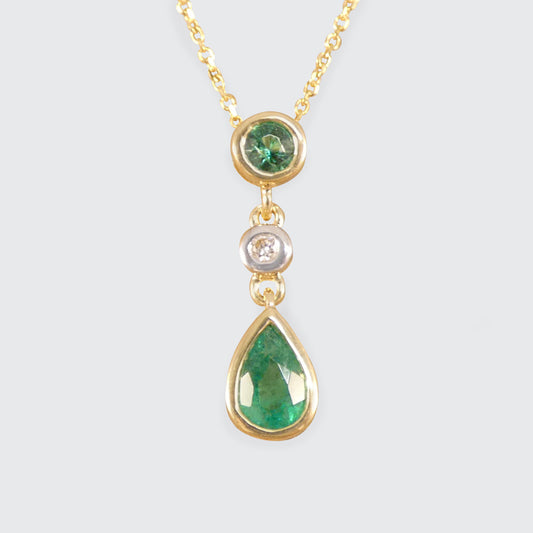 Modern Emerald and Diamond Bezel Set Drop Pendant Necklace in Yellow Gold