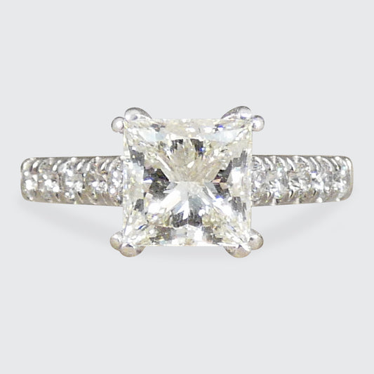 A gorgeous Princess cut Diamond Solitaire ring with diamond set shoulders in 18ct White Gold, the perfect engagement ring.