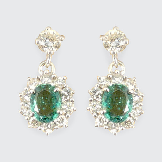 A pair of Emerald and Diamond cluster drop earrings with clear and bright diamonds.
