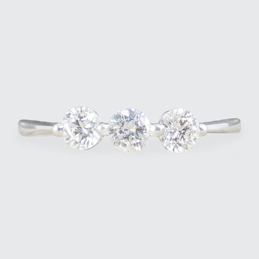 A bright and beautiful diamond three stone ring set in 18ct white gold.