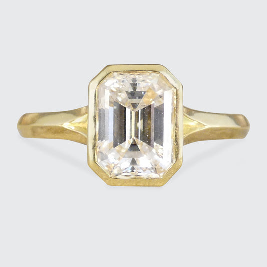 1.55ct Emerald Cut Diamond Solitaire in a Bezel Setting in 18ct Yellow Gold