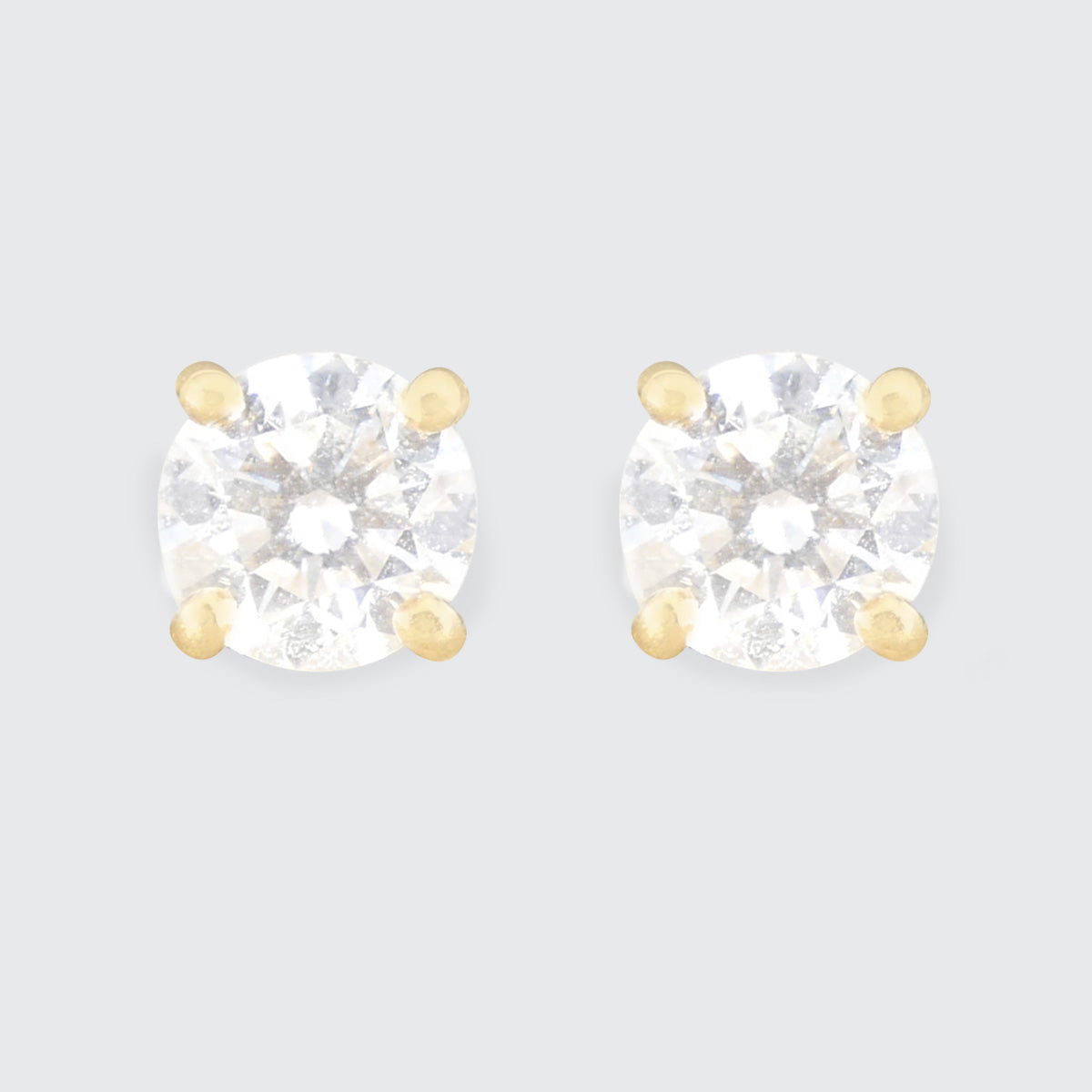 A pair of clear and bright Diamond stud earrings in 18ct yellow gold.