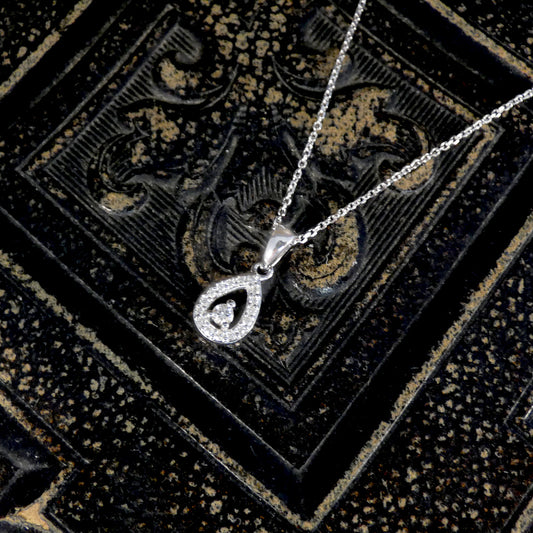 Diamond set teardrop shaped cluster necklace in white gold.