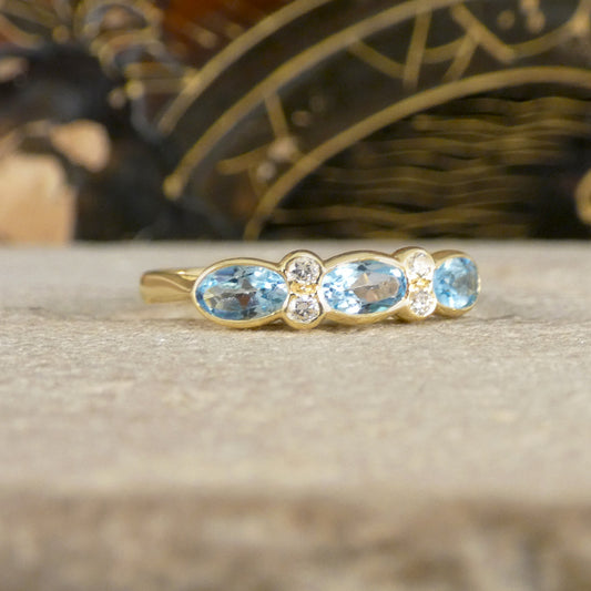 Blue Topaz and Diamonds ring in Yellow Gold