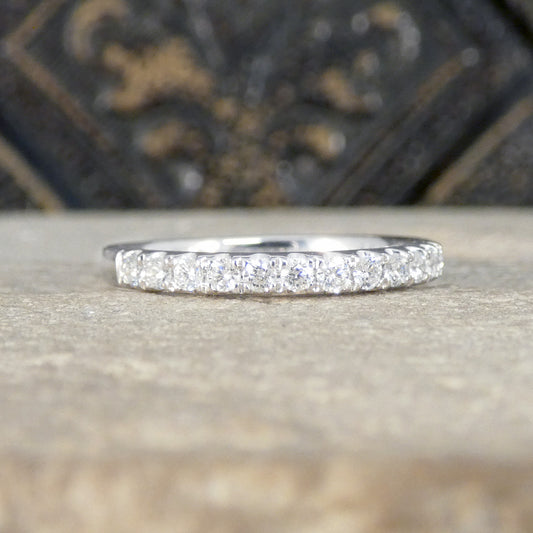 Platinum ring with small diamonds on a textured surface