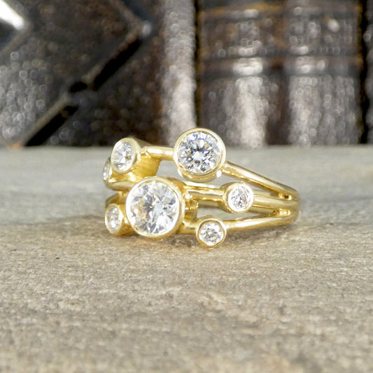 Classic bubble style ring with Diamonds in full bezel settings across three strands.
