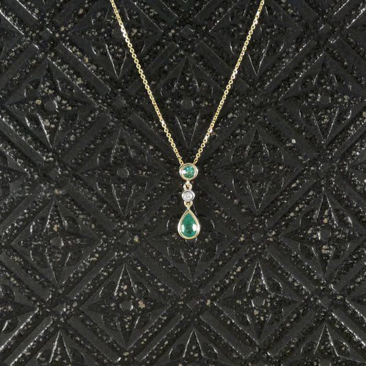 Modern Emerald and Diamond Bezel Set Drop Pendant Necklace in Yellow Gold
