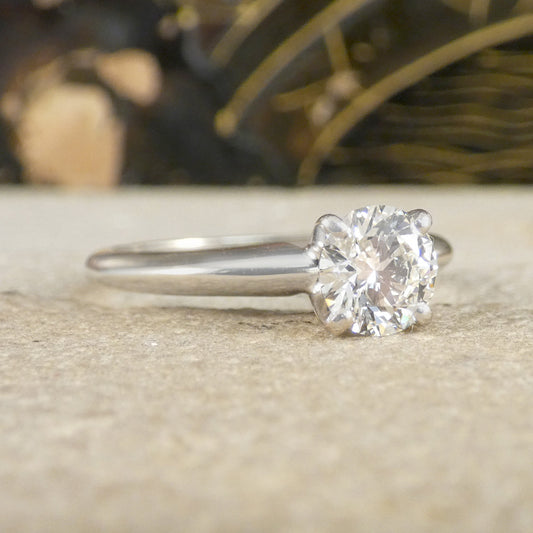 A diamond solitaire high set ring in white gold