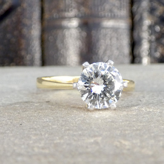 Vintage Diamond solitaire engagement ring in 18ct yellow and white gold in a high 6 claw setting.