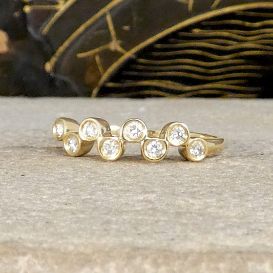 Brilliant cut Diamonds set in a bubbled band in 9ct Yellow Gold. The perfect stackable ring or to be worn solo. Unique and stand out design.