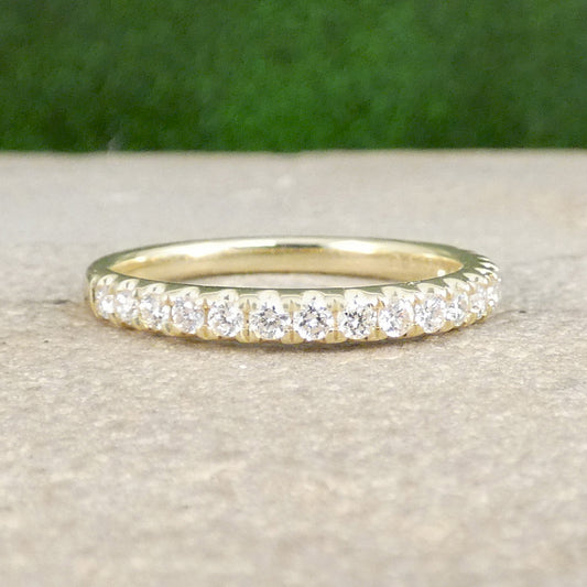 A diamond half eternity ring in yellow gold, perfect stacking ring