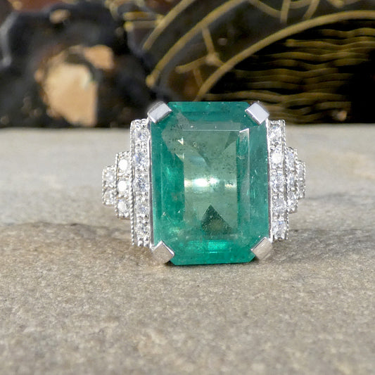 Featuring a 7.15ct Emerald with and bright colour and typical Emerald flaws, this ring would make the perfect statement dress ring.