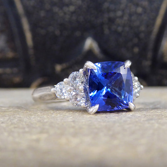 Vibrant 2.40ct Cushion Cut Tanzanite and Diamond Trio Set Shoulders in Platinum - Wharfedale Antiques