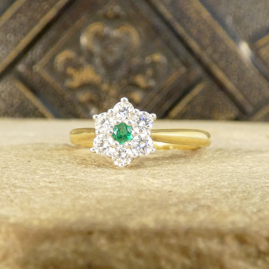 A beautiful and dainty Emerald and Diamond flower cluster ring in 18ct Yellow and White Gold.