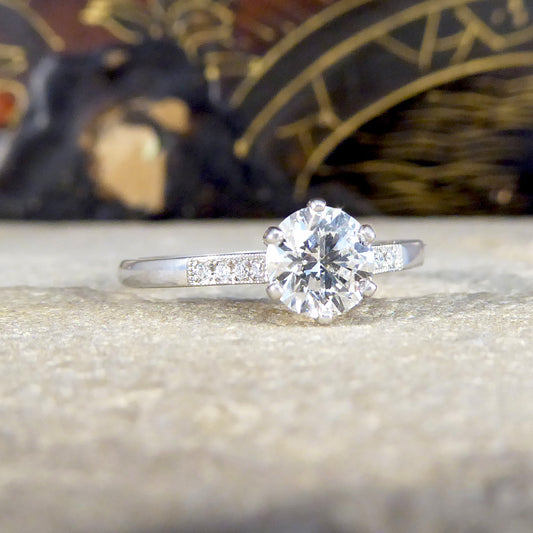 Diamond ring on a textured surface with a blurred decorative background