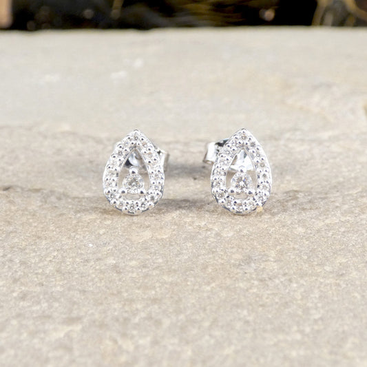Diamond cluster earrings in teardrop shape.