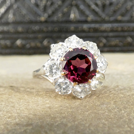 2.00ct Pyrope Garnet and 1.40ct Brilliant Cut Diamond flower cluster ring in 18ct White Gold with Yellow Gold claws on the Garnet. Bright and beutiful.