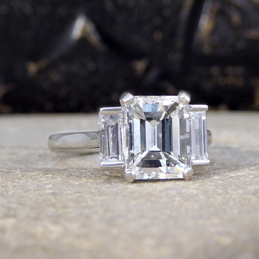 2.57ct Emerald and Baguette Cut Three Stone Ring in Platinum - Wharfedale Antiques