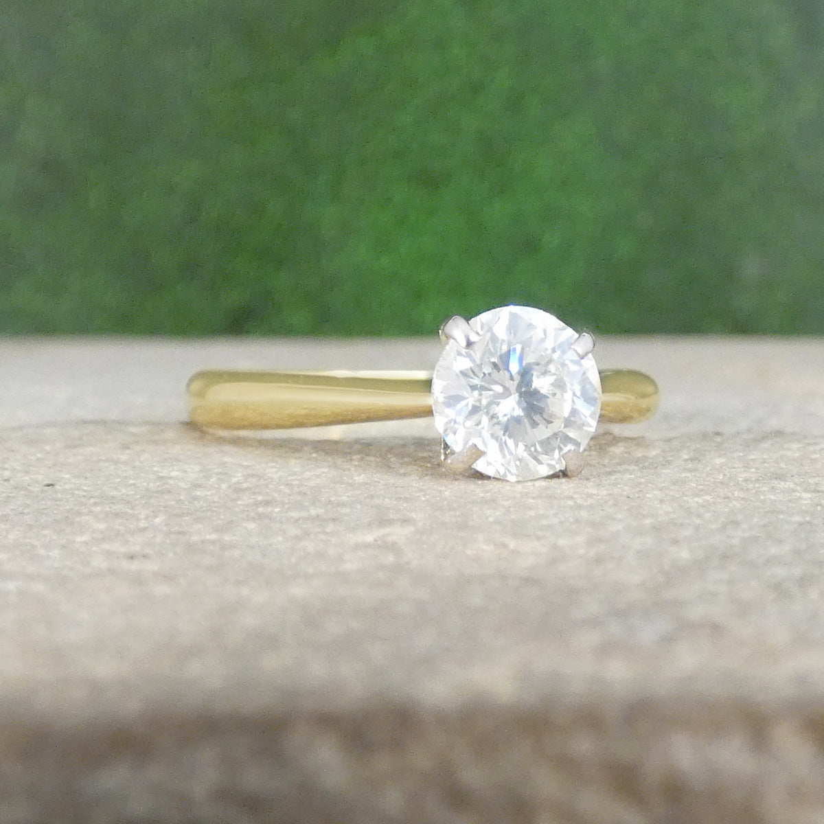 Classic Brilliant Cut Diamond Solitaire Engagement Ring in 18ct White Gold setting leading to an 18ct yellow gold band.