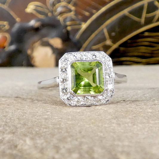 Art Deco Style Peridot and Diamond Cluster Ring in Platinum showing a bright and vibrant green hue.