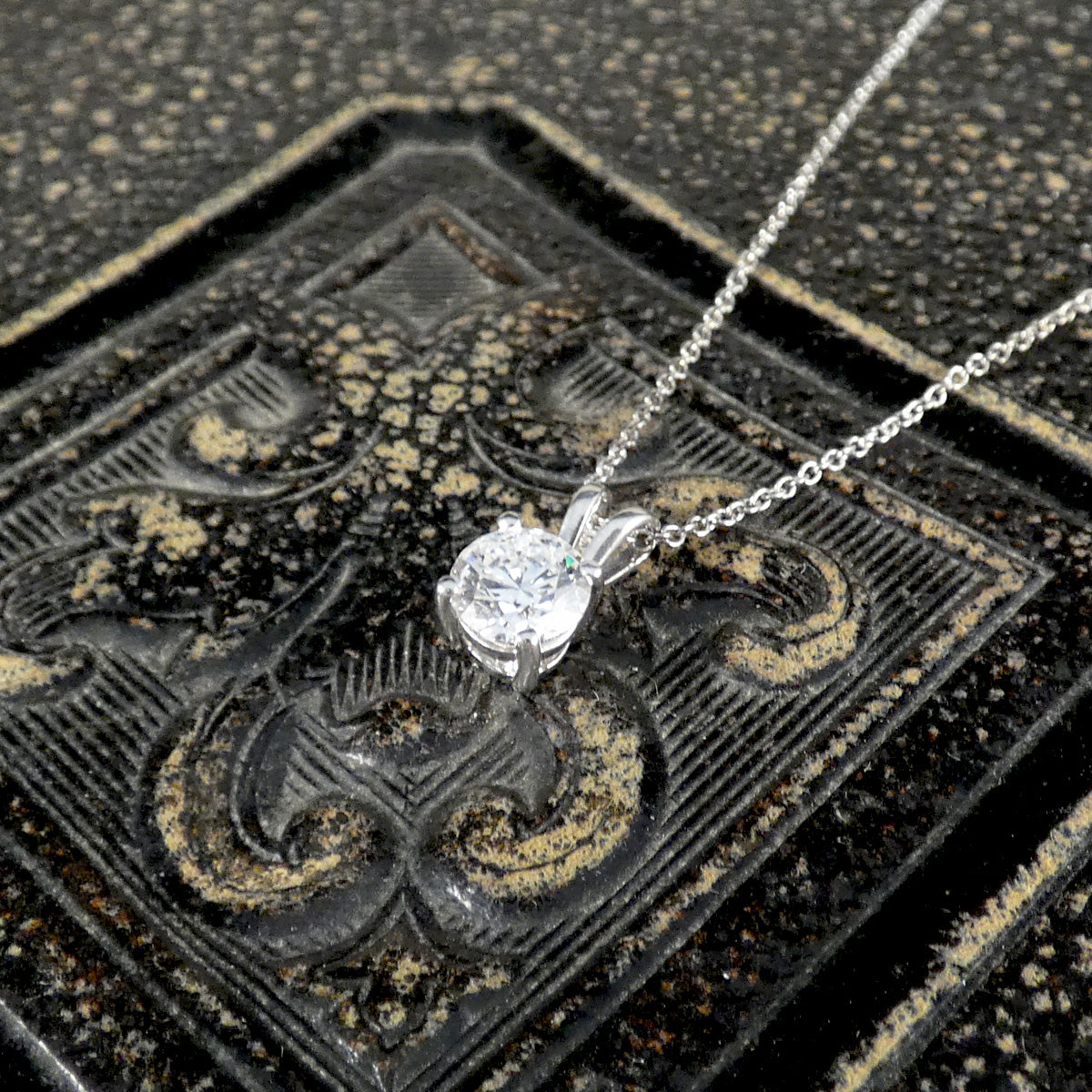 Diamond Solitaire pendant necklace in 18ct white gold on an 18ct white gold trace chain. The perfect sparkly gift featuring a bright and sparkly 0.71ct round brilliant cut diamond.