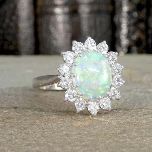 Opal and Diamond Cluster Ring in 18ct White Gold showing bright and lively colours through the Opal.