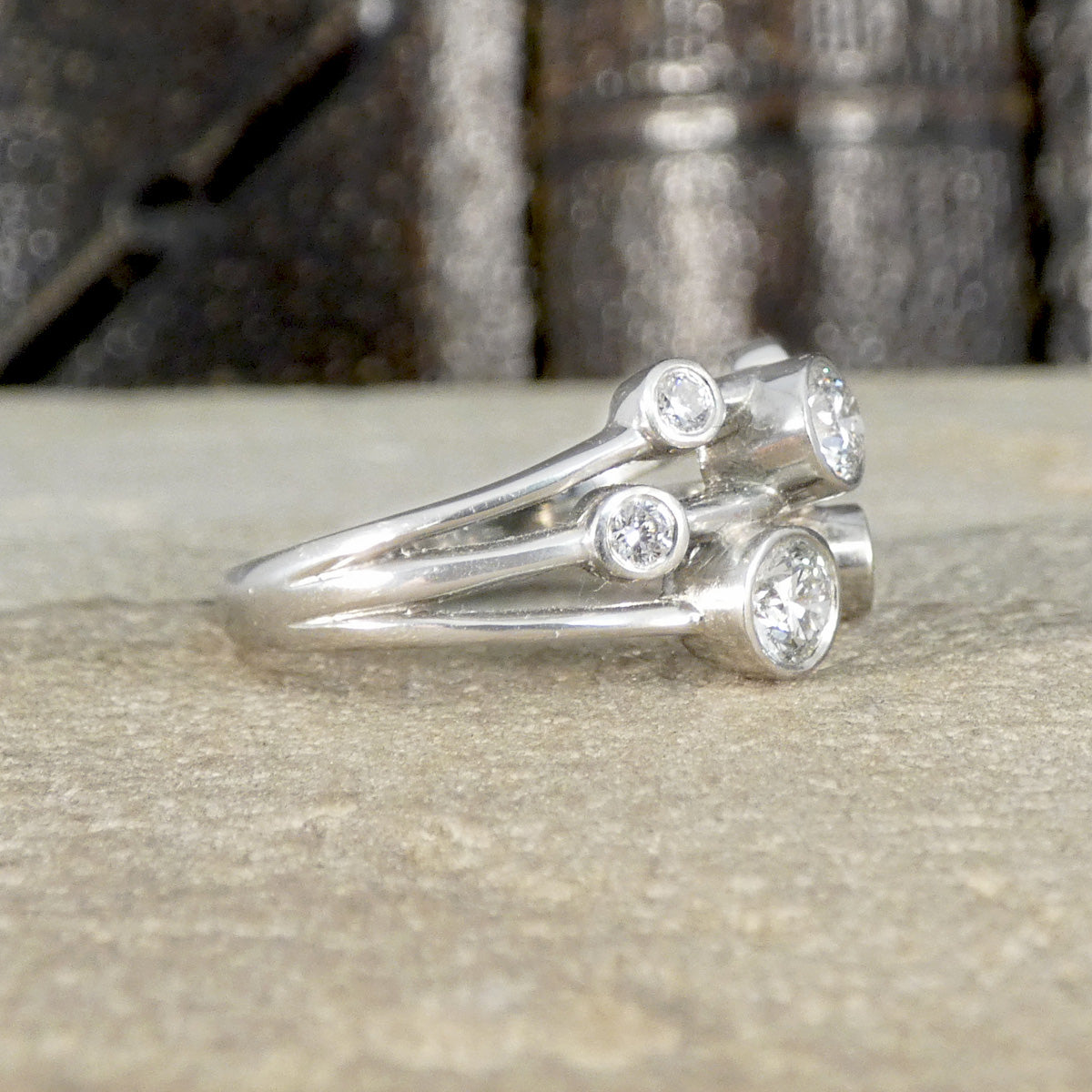 Side view of diamond set bubble style ring in platinum with clear and bright diamonds.
