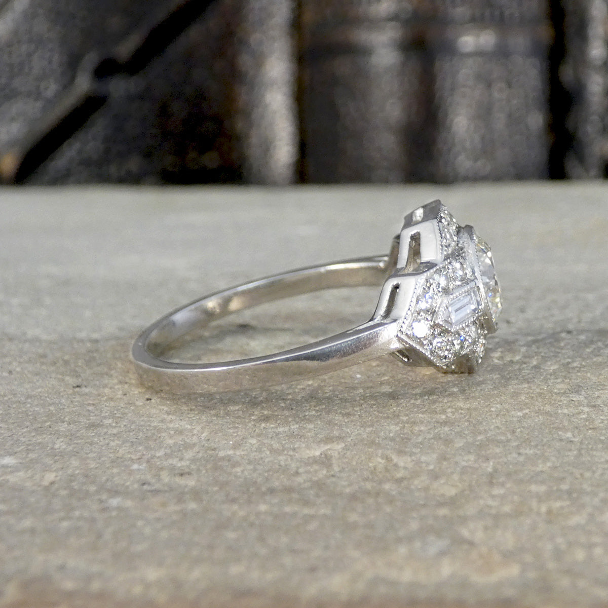 Side view of Art Deco inspired Diamond cluster ring in Platinum. Showing a plain polished fine platinum band.