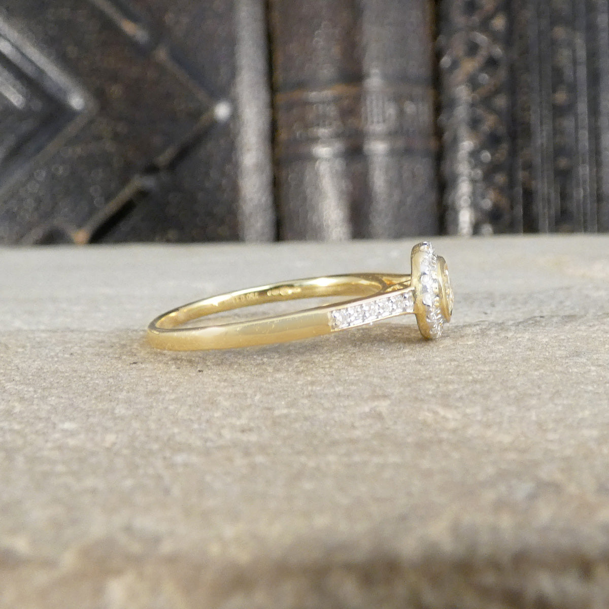 Side profile of diamond cluster ring showing wedfit design and plain polished band.