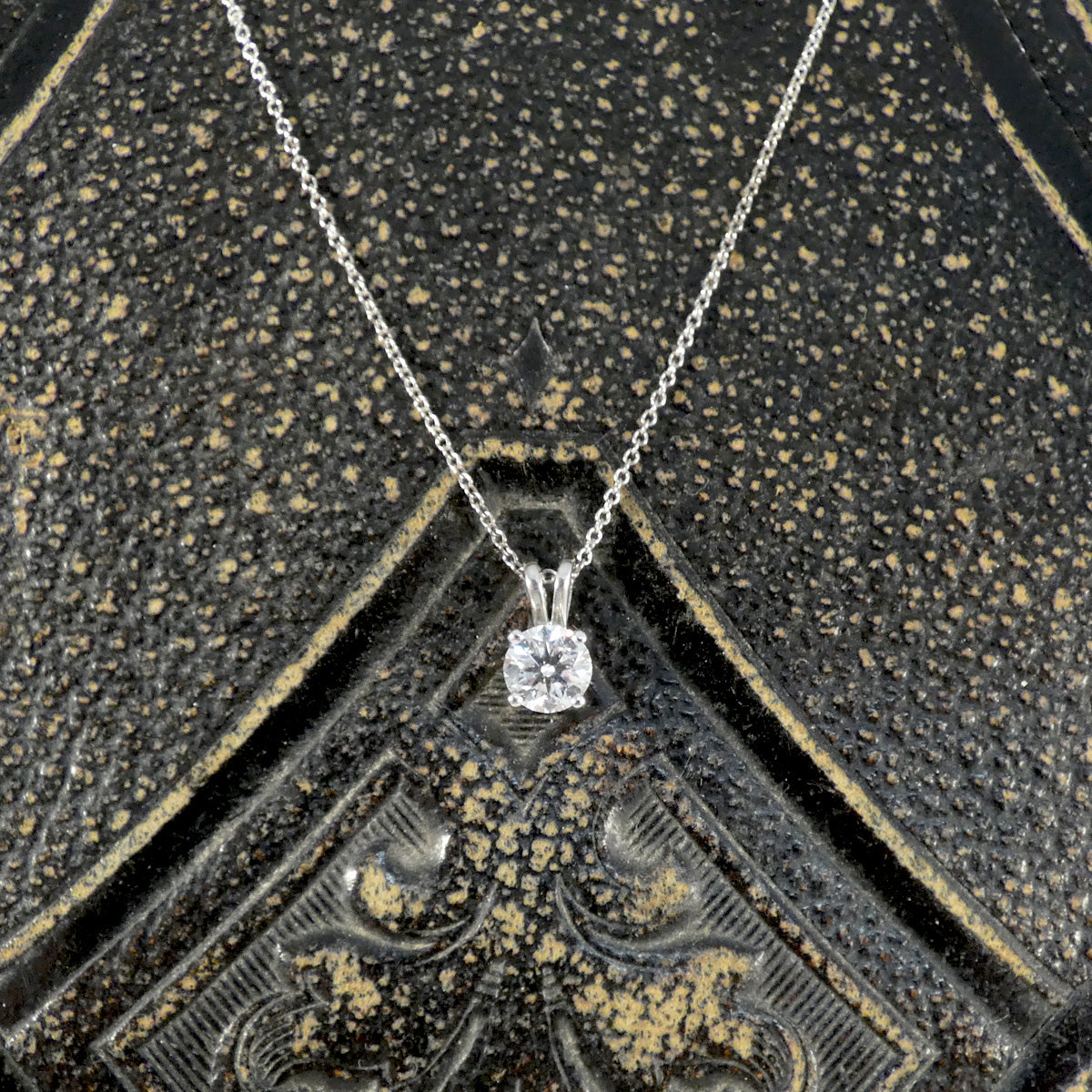 Diamond Solitaire pendant necklace in 18ct white gold on an 18ct white gold trace chain. The perfect sparkly gift featuring a bright and sparkly 0.71ct round brilliant cut diamond.
