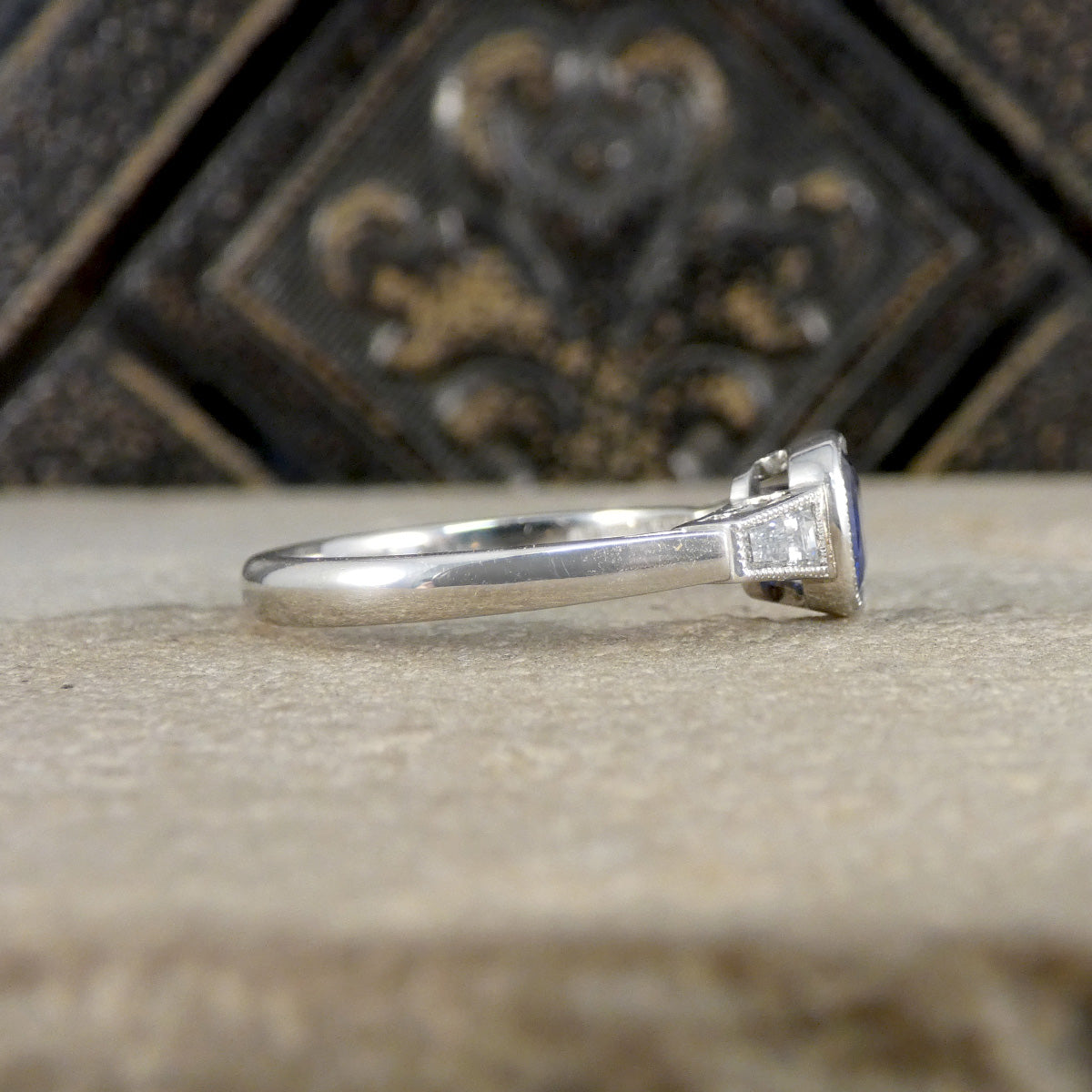 Side view of Sapphire and Diamond ring showing plain polished band.