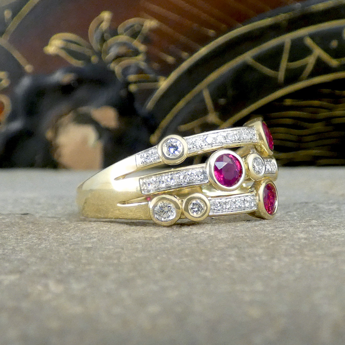 Side profile of Ruby and Diamond bubble ring, showing how far the stones are set around the finger, similar to a half eternity ring.
