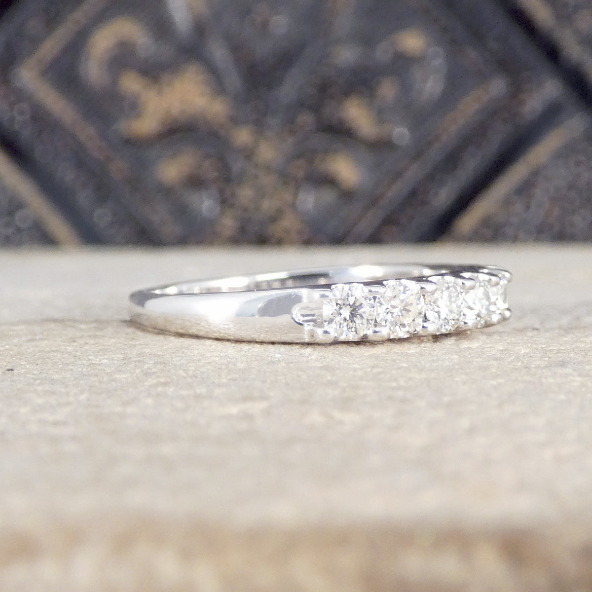 side view of diamond half eternity ring.
