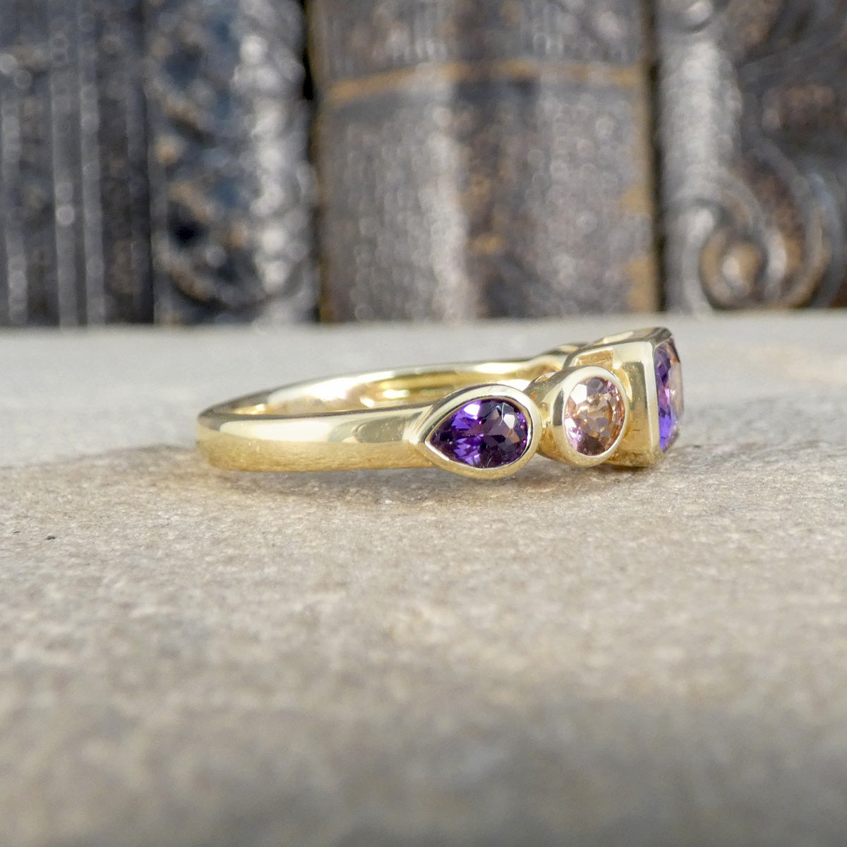 Side view of Amethyst and Pink Tourmaline Five Stone Ring in Yellow Gold.