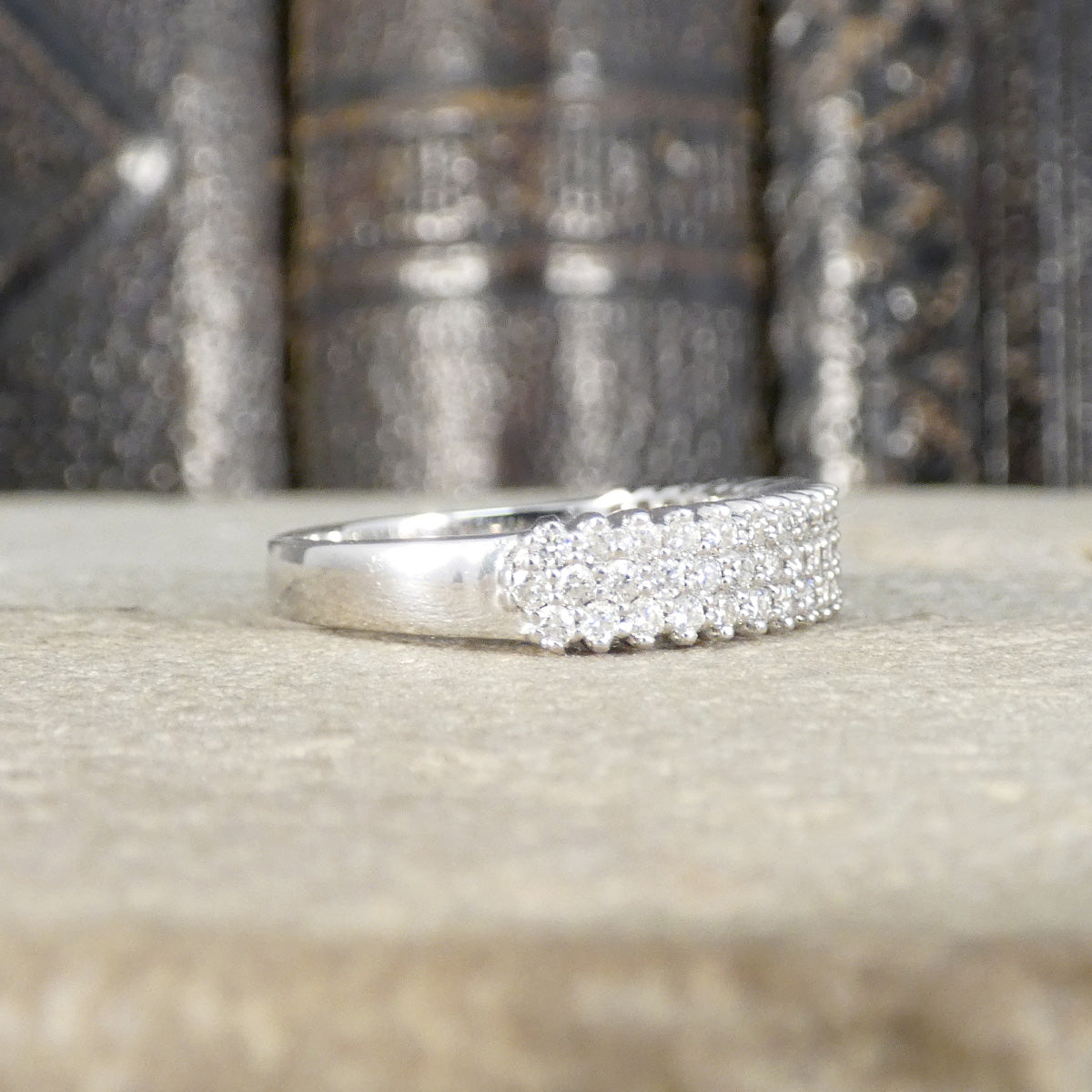 Half diamond set, half plain and polished ring.