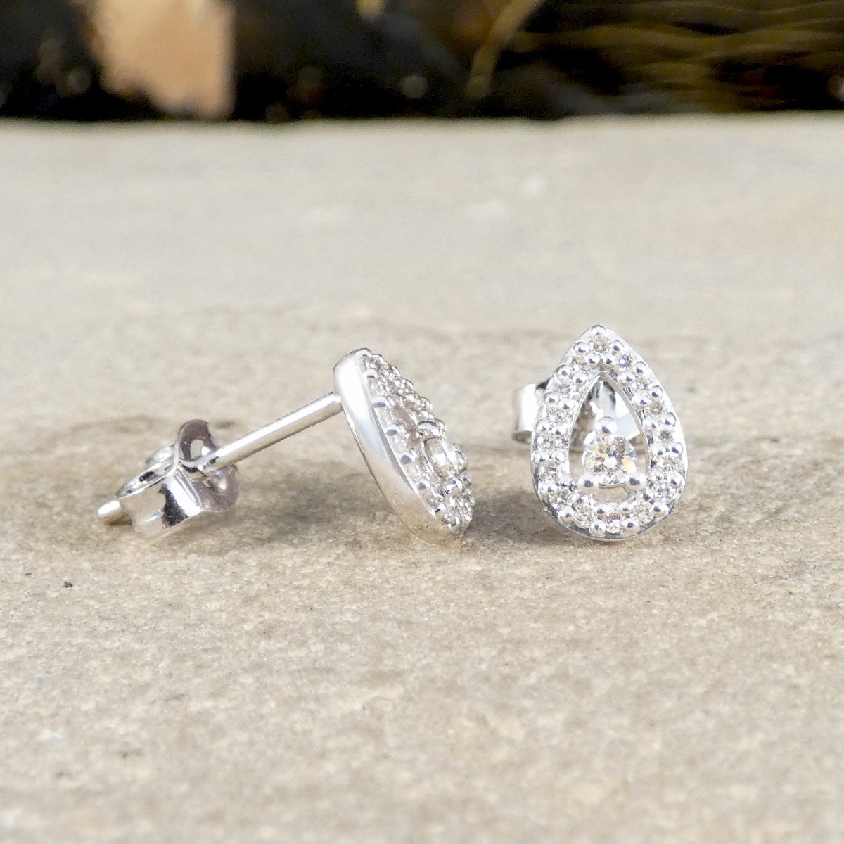 front and side profile of damond cluster earrings.