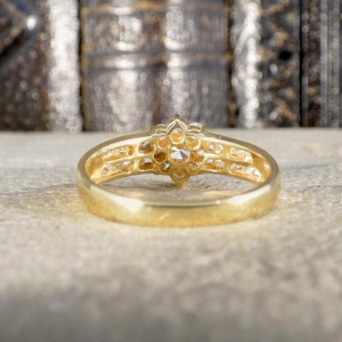 Back view of diamond cluster ring in 18ct yellow gold showing full open setting.