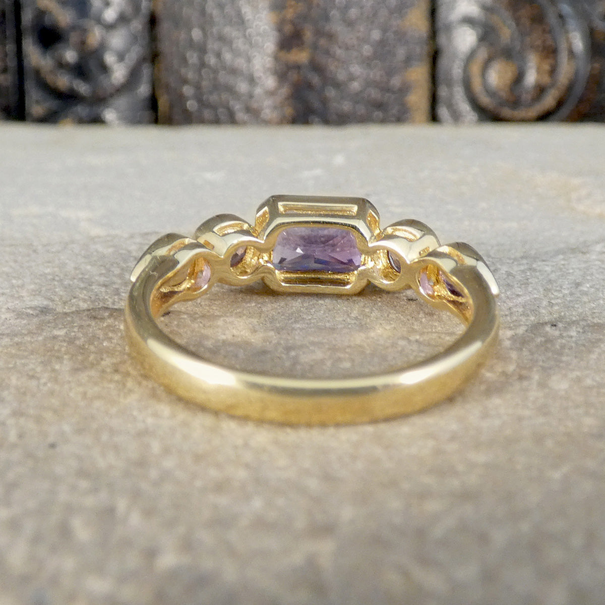 Back view of Amethyst and Pink Tourmaline Five Stone Ring in Yellow Gold showing open settings.