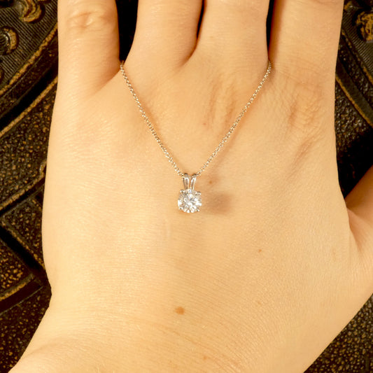 Diamond Solitaire pendant necklace in 18ct white gold on an 18ct white gold trace chain. The perfect sparkly gift featuring a bright and sparkly 0.71ct round brilliant cut diamond.