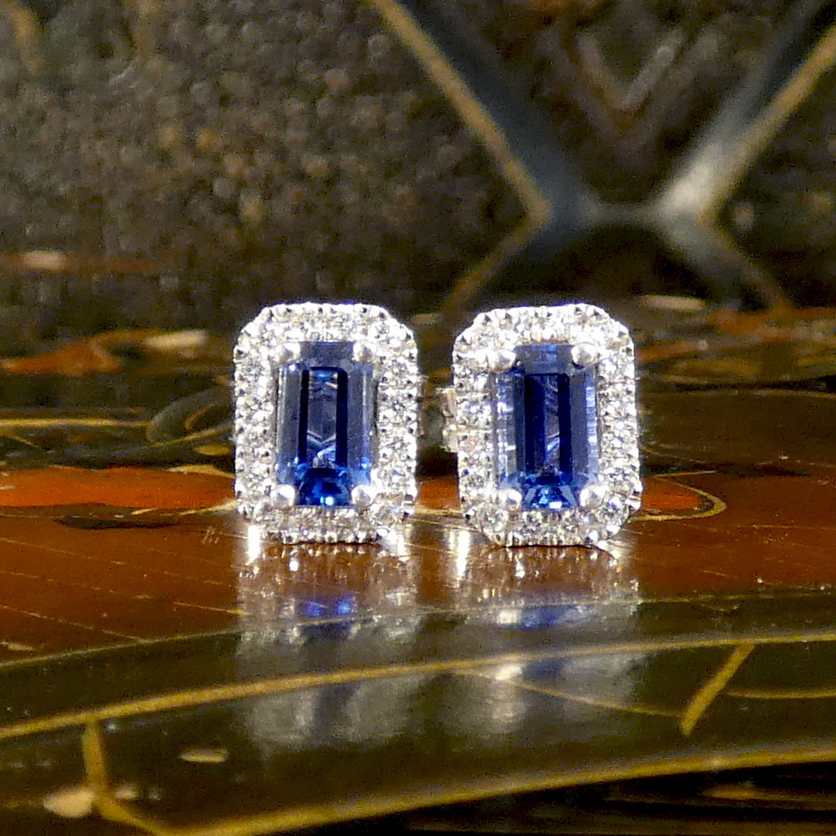 A paid of Sapphire and Diamond Halo Cluster Stud Earrings in 18ct White Gold. The perfect gift.