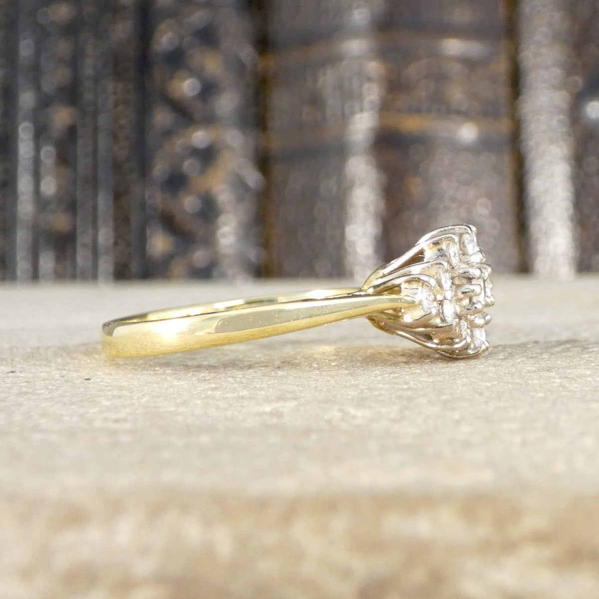 Side profile of diamond vintage diamond cluster ring in 18ct yellow gold.
