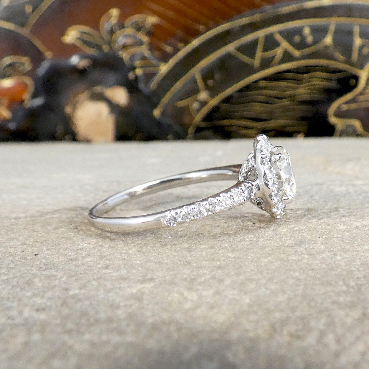 Diamond cluster ring with Diamond shoulders and settings.