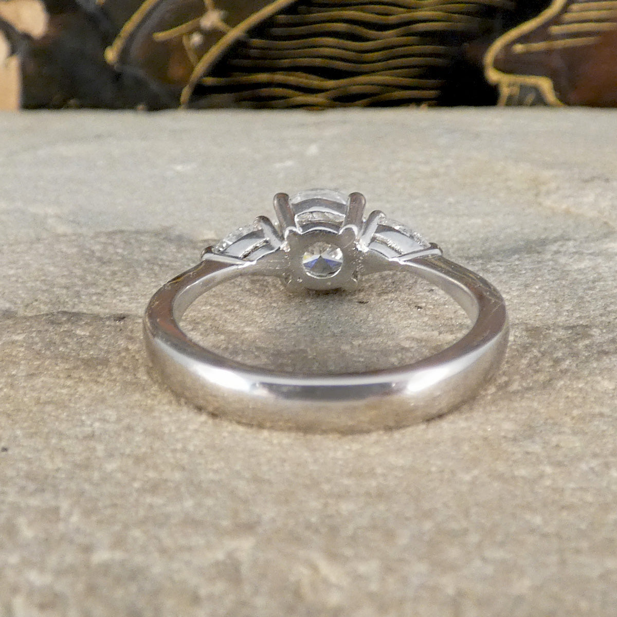 Back view of diamond three stone ring in platinum.