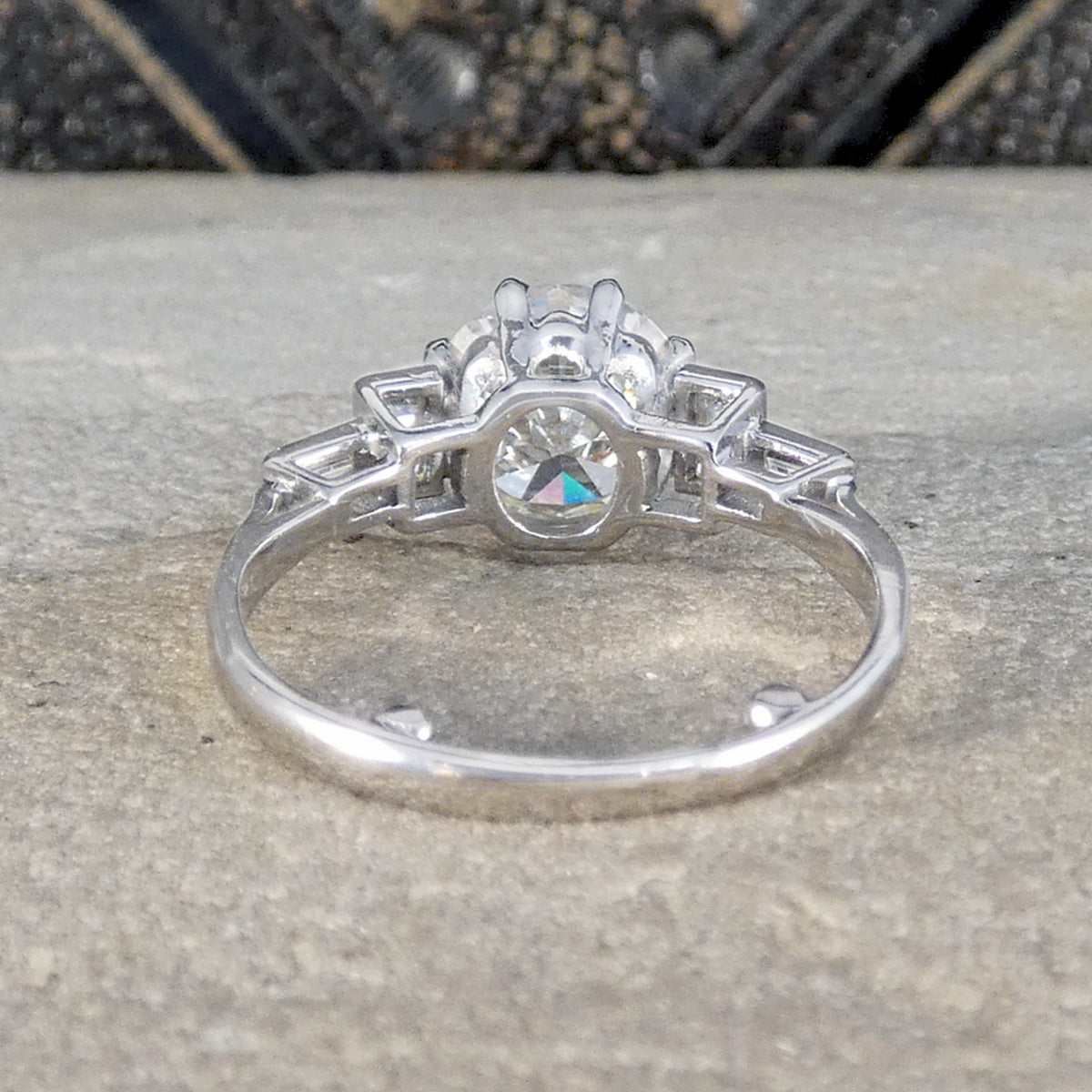back view of diamond ring showing open setting in platinum.